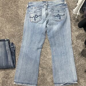 Guess Light Blue Flared Jeans with Embroidered Back Pockets